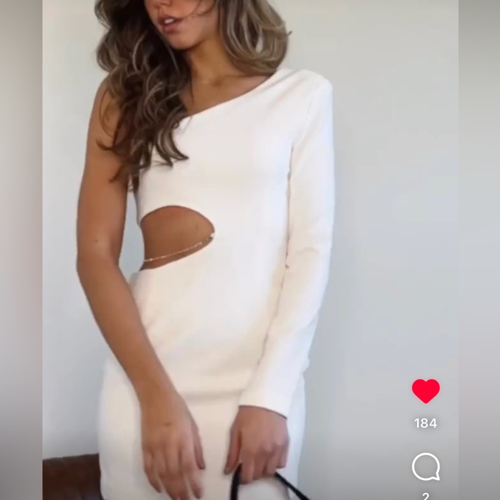 White cut out mini dress with diamond chain on waist